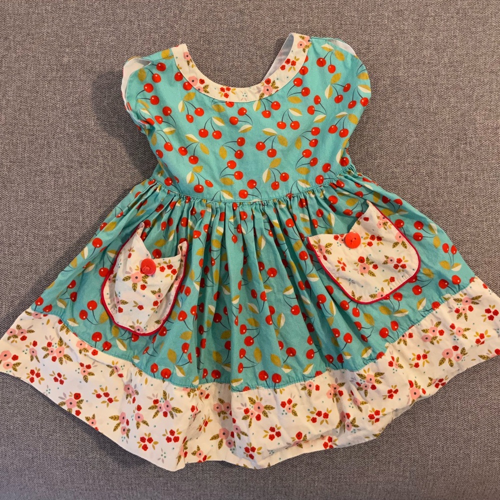 Miss. Marmalade dress with cherry & floral, back detail and pockets, size 2.